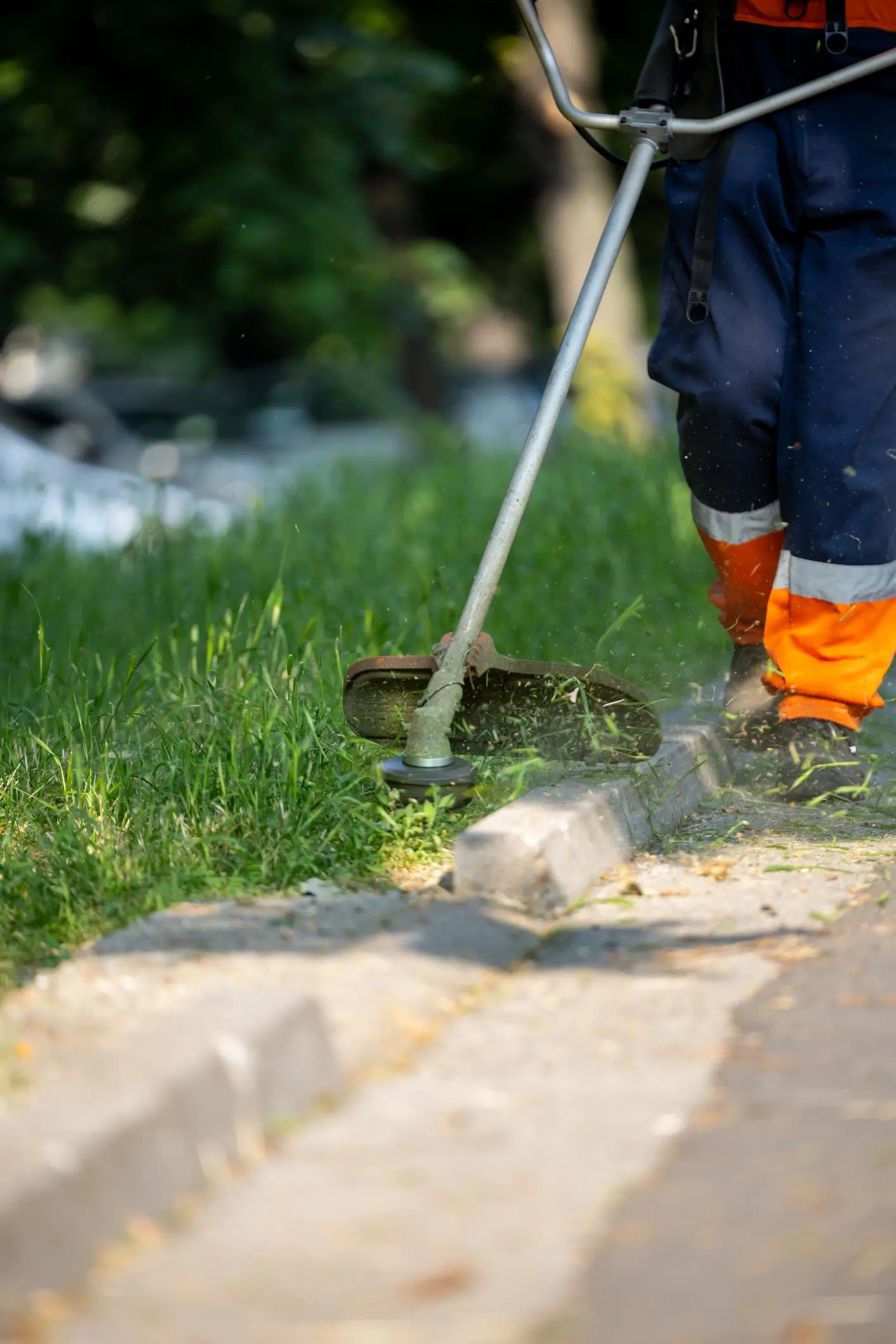Local landscaper weed eating the edges