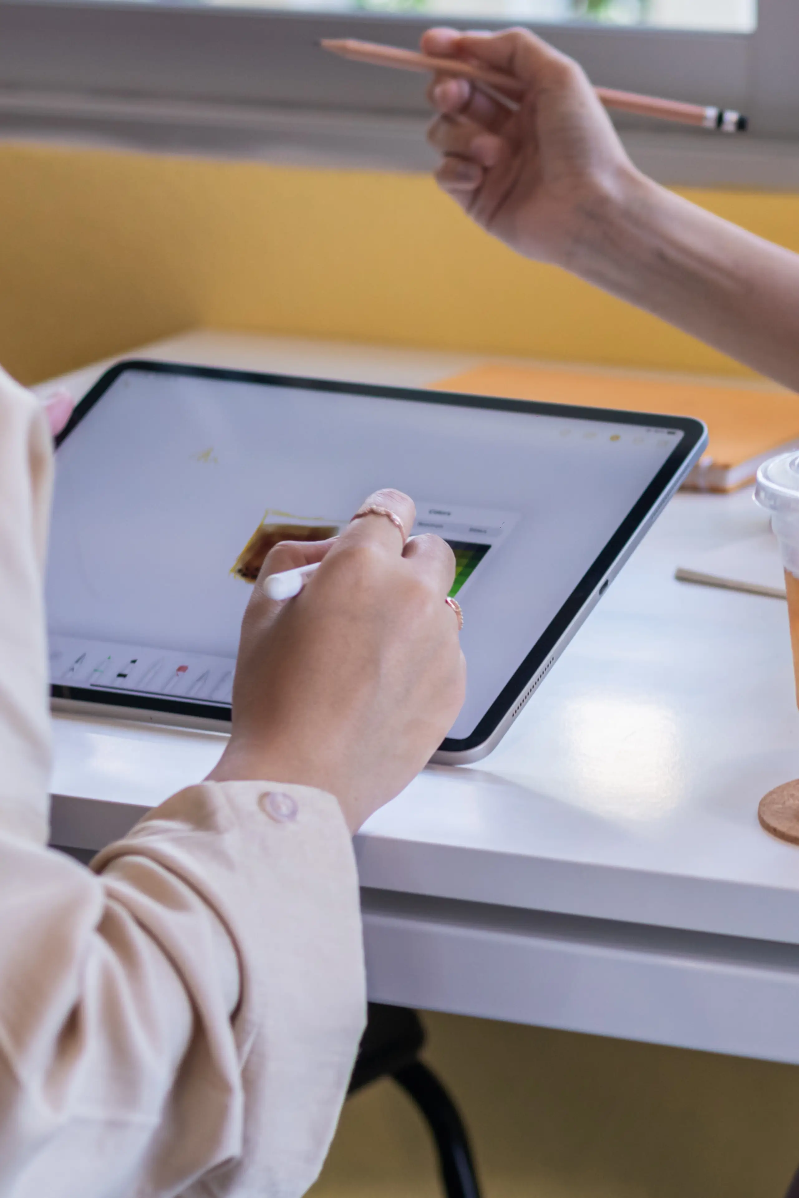 Web Designer planning a website on their tablet device