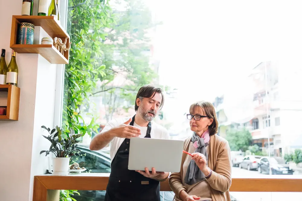 Small business owners reviewing a website on their tablet