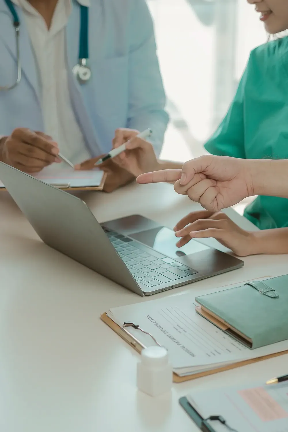 Doctors viewing a laptop screen