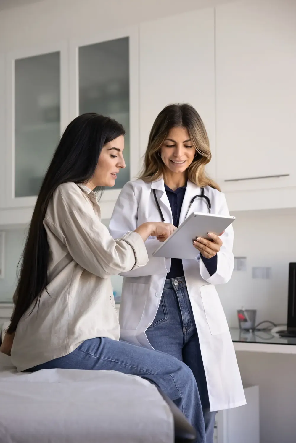 Doctor going over patient's chart with the patient